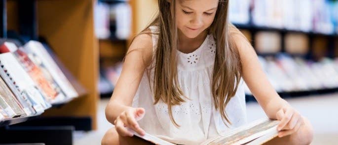 Young girl reading a book