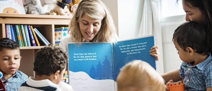 School teacher reading with her class