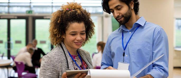Teachers looking at documents together