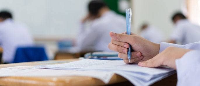 Child writing at school