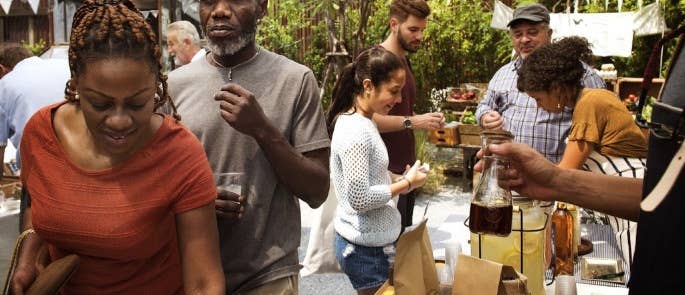 diverse people choosing from festival food stall