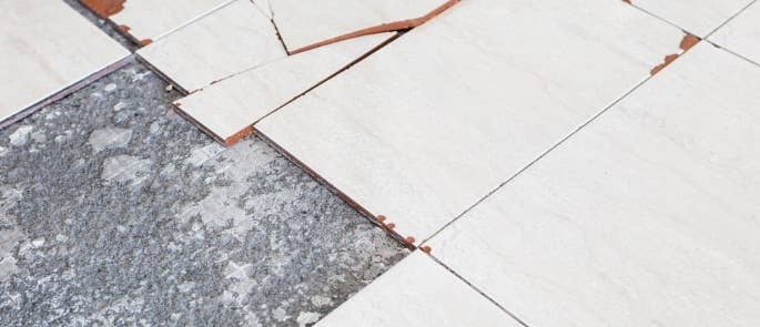 Broken floor tiles that contain asbestos