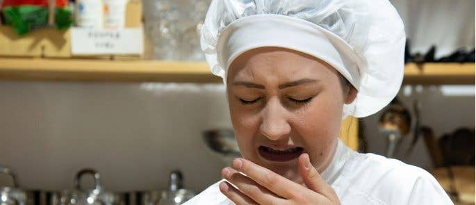 chef sneezing while preparing food