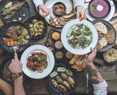 plates of food round dinner table