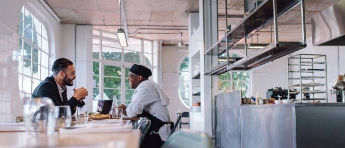 Chef chats with young man who has come to interview for a kitchen position