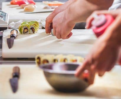 sushi chefs prepare food in virtual restaurant