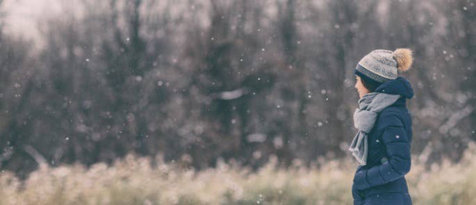 Woman walking outside in the snow