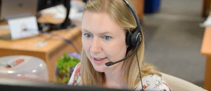 An image of High Speed Training's customer support team using a headset to respond to queries