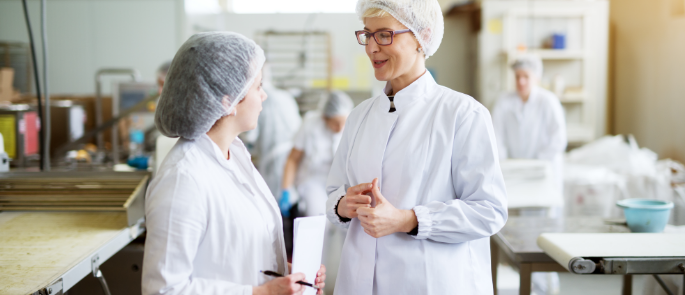 Ladies in hair nets and protective clothing