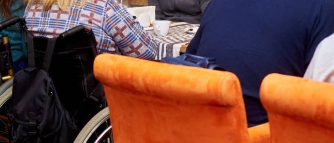 Person with wheelchair in a cafe