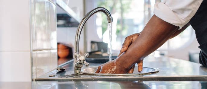 Male chef washing his hands