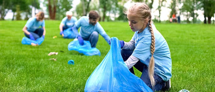 School volunteers helping to pick up waste