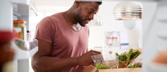 A man unpacking his online food delivery