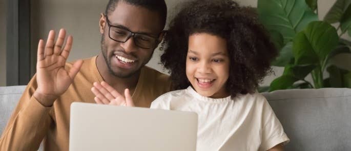 Father and daughter having a video call