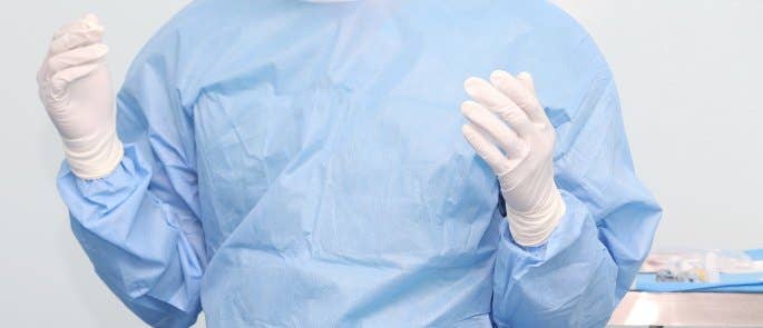 Surgeon wearing sterile gloves