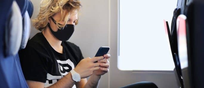 Commuter wearing face mask on train