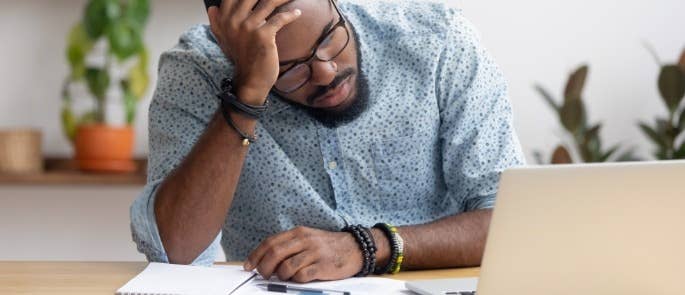 Stressed employee working from home