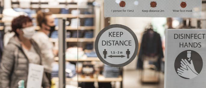Workplace with social distancing instructions COVID-19