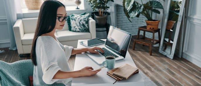 woman work at home with cushion and blanket on chair