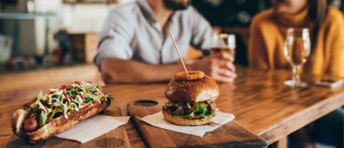 couple enjoying restaurant meal after lockdown