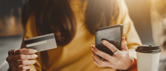 Woman makes payment with card over the internet