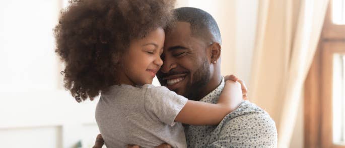 Father and daughter hugging each other