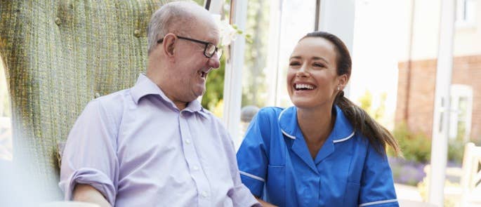 Carer and service user laughing