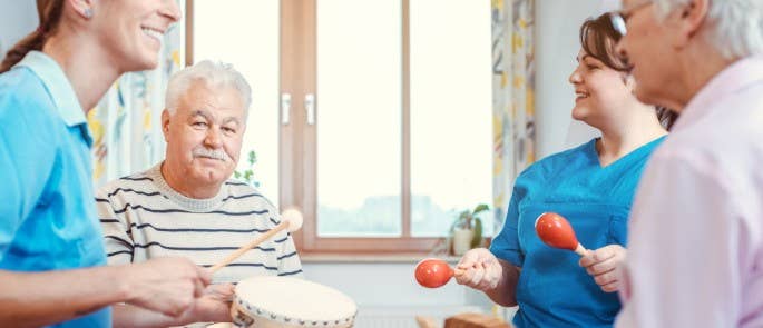 Group music therapy session in elderly care home