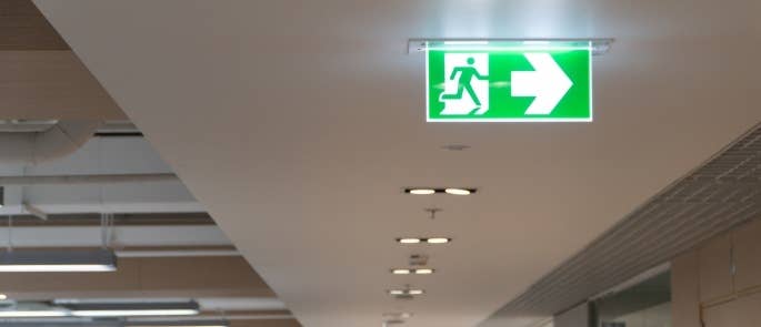 Fire exit sign in a building hallway