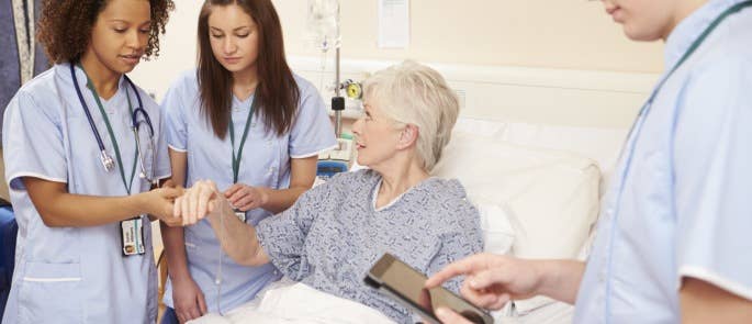 Health and social care workers talking to a service user