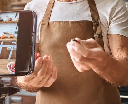 person filming themselves cooking