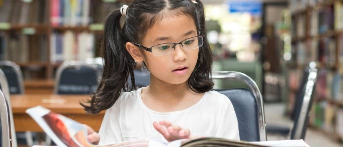 A young child reading a book