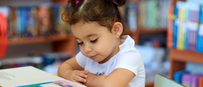 A young child reading a book