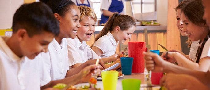 Children enjoying dinner at school