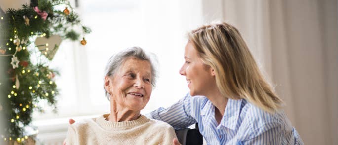 Resident and care worker talking to each other