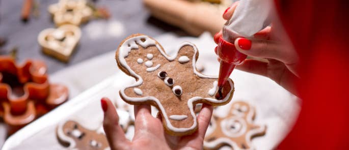 Decorating a gingerbread man at Christmas time