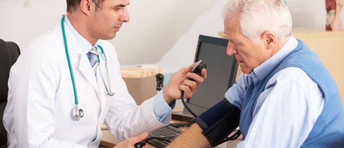 A doctor checking on an elderly patient