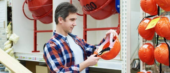 Employer looking at hard hats