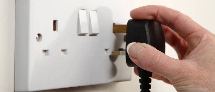 Plug being put into a socket