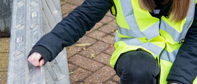 Worker inspecting ladder before use