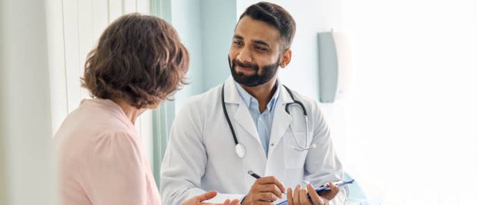 A doctor discussing menopause with his patient