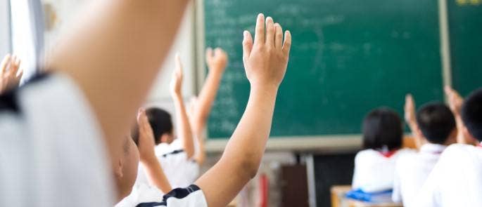 Students in a classroom to represent a classroom without educational bias