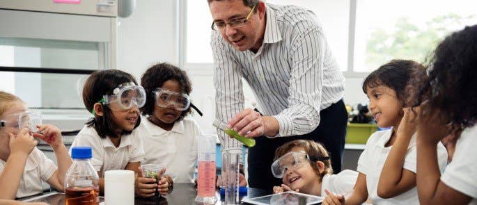 A science classroom with diverse, happy students.