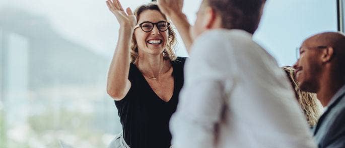 Employees celebrating in the workplace