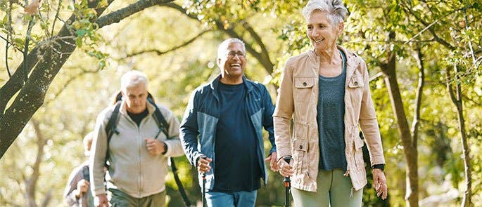 A group of people on a walk experiencing positive emotions