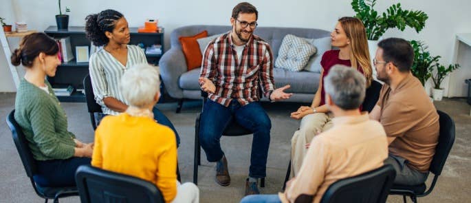 A group therapy session where active listening is key in helping people with their mental health