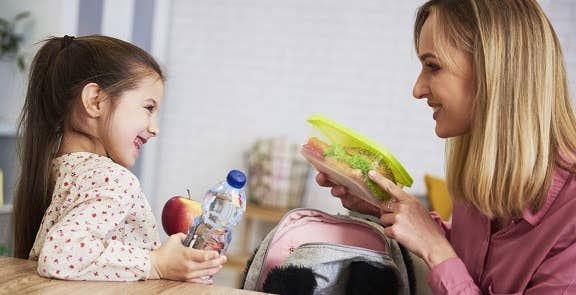 Representation of a parent teaching a child to be happy and confident 