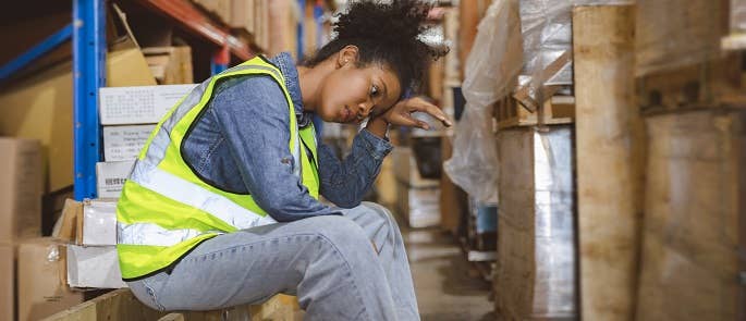 A warehouse employee that is showing signs of burnout or brownout 