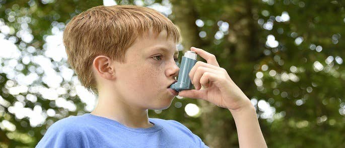 A child using an inhaler