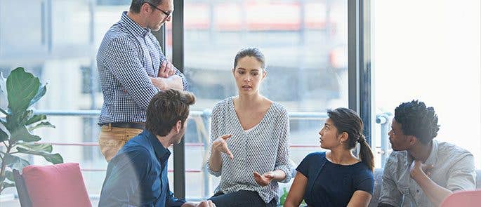 Employees gathered and communicating effectively as they are all face to face